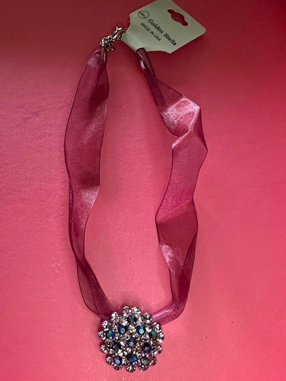 Purple rhinestone floral necklace. Retails at $30.